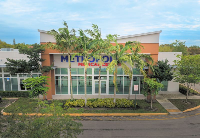 Aerial view of the building entrance and parking lot
