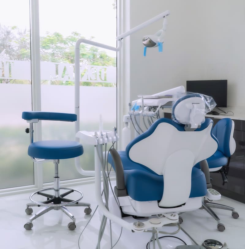 Dental chair and instruments in a bright room